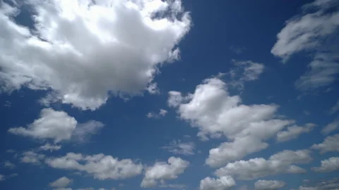Fluffy white clouds moving on blue sky in the day Stock Footage 165292150