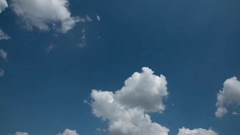 Fluffy white clouds moving fast time lapse. Sunny weather, cloudy heaven Stock Footage 108125151