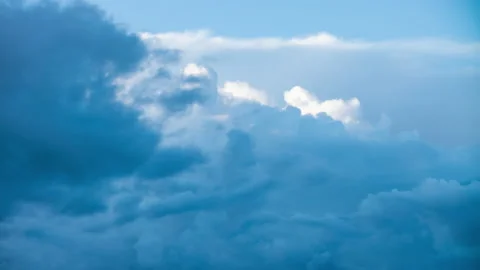 Fluffy white clouds moving fast in time-lapse. Daylight, cloudy heaven Stock Footage 136309437