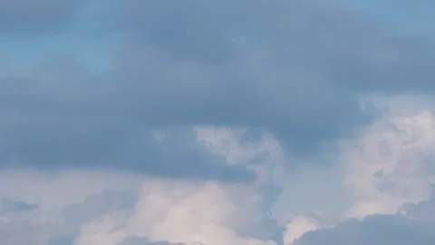 Fluffy White Clouds Moving Fast Across Deep Blue Sky Time-lapse Stock Footage 326706342