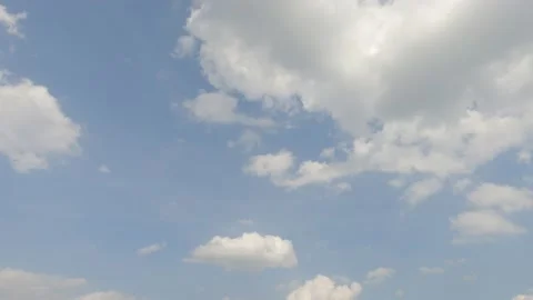 Fluffy white clouds n cumulus cloudscape on beautiful sunny clear blue sky Stock Footage 151446992