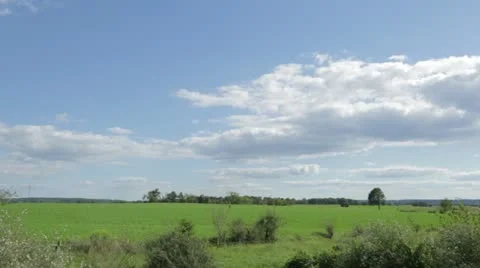 Fluffy White Clouds Over Lush Green Countryside Stock Footage 21456021