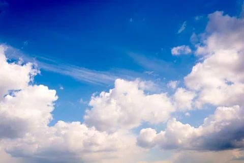 Fluffy white clouds Stock Photos