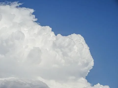 Fluffy white clouds in Romania Photos