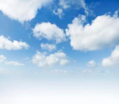 Fluffy white clouds in sky Stock Photos