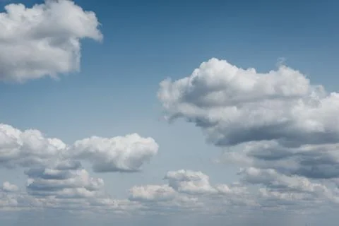 Fluffy white clouds in the sky. Stock Photos