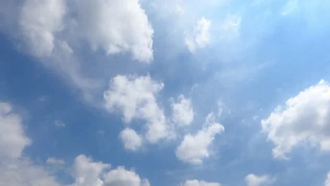 Fluffy white clouds in sunny day blue sky background Stock Footage 204868856