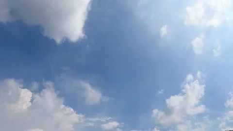 Fluffy white clouds in sunny day blue sky background Stock Footage 204869134