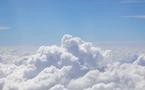 Fluffy white clouds viewed from above and customizable space with text on t.. Photos