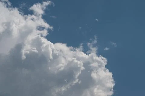 Fluffy white cumulus cloud against blue sky Photos