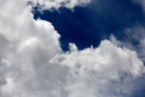 Fluffy white cumulus cloud formations Stock Photos