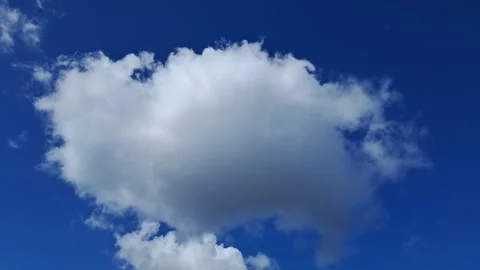 Fluffy White Cumulus Clouds Drifting Across Blue Sky Stock Footage 332274735