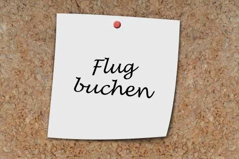 Flug buchen written on a memo Stock Photos