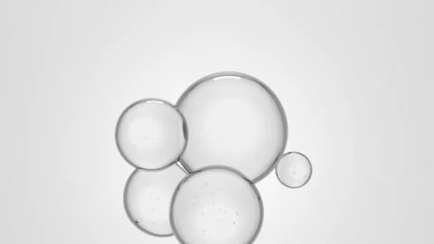 Fluid cell particles float in zero gravity attracted to each other. Video stock 307171772