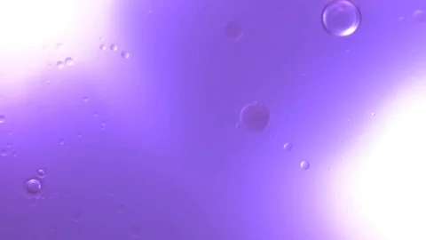 Fluid Drops dripping to violet Water (Macro) Video stock 85151733