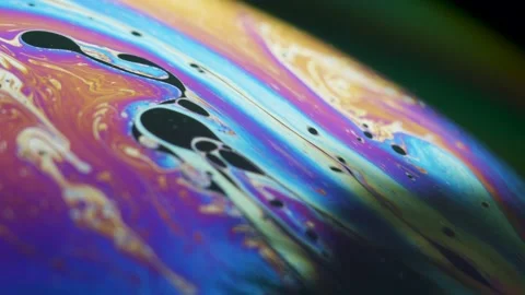 Fluid dynamics and light refraction diffraction in soap bubble surface Stockbeeldmateriaal 136340068