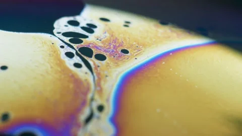 Fluid dynamics and light refraction diffraction in soap bubble surface Stock Footage 136340072