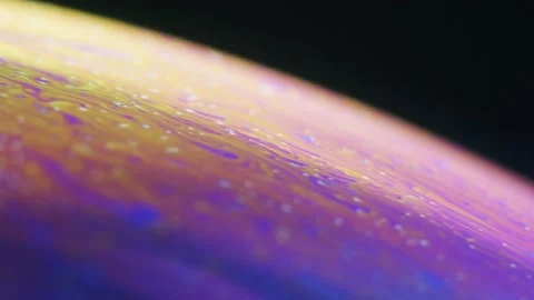 Fluid dynamics and light refraction diffraction in soap bubble surface Stock Footage 136340103