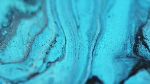 Fluid paint flow glitter ink mix blue black wave Stock Footage 272487011