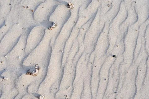 Fluid patterns on white sand in Juan Lacazes Beach, Colonia, Uruguay Stock Photos