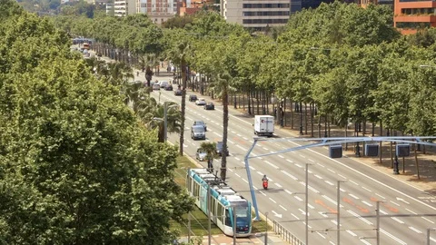 Fluid traffic and a tram in Diagonal Avenue, Barcelona Stock Footage 108870327