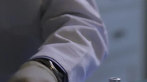 Fluid transfer from container to container using syringe Stock Footage 20446434