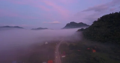 Fluing right above clouds next to the mountain with panorama Stock Footage 108469644