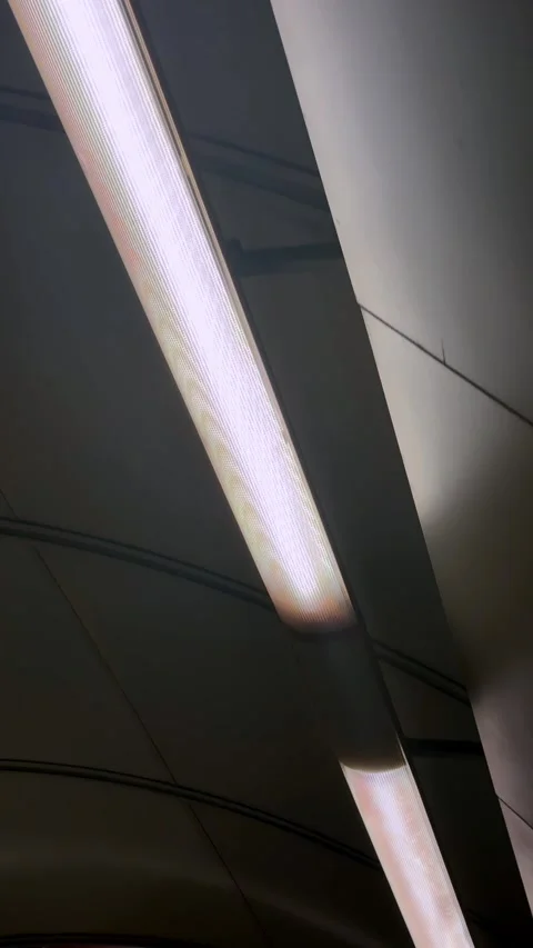 Fluorescent ceiling fixture moving through an illuminated underground passage, Stock Footage 333110625