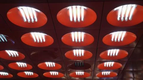 Fluorescent ceiling lights in red circles in Prague metro Stock Photos