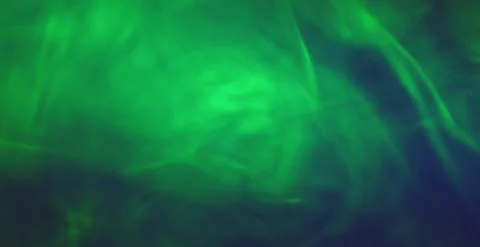 Fluorescent Dye Diffusing in Water Under UV Light Macro Stock Footage 314124908