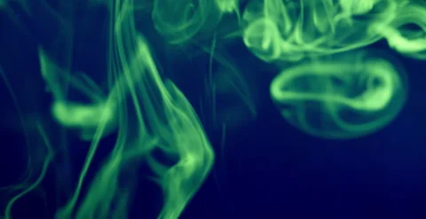 Fluorescent Dye Diffusing in Water Under UV Light Macro Stock Footage 314125371