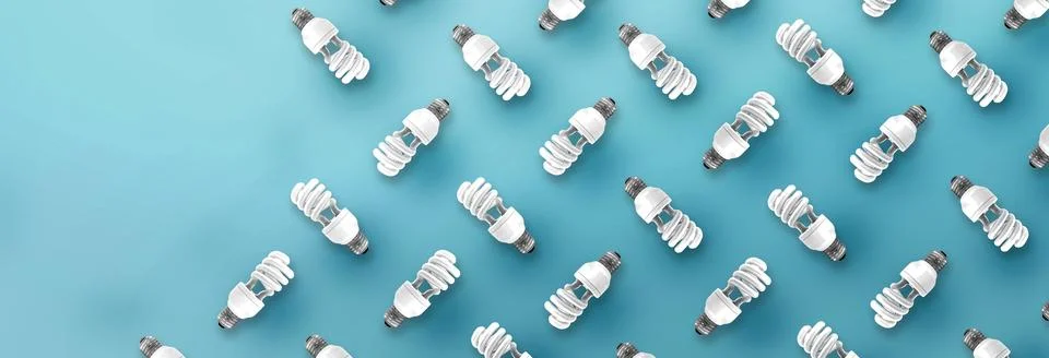 Fluorescent Light Bulb pattern on blue background. Stock Photos