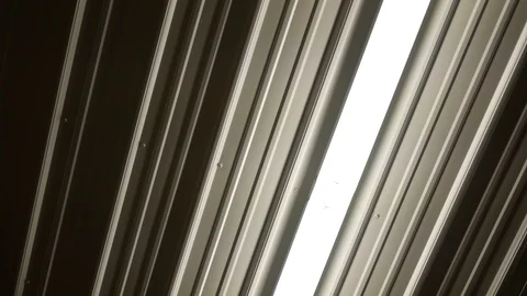 Fluorescent lighting turns on inside warehouse or bunker Video stock 91156885