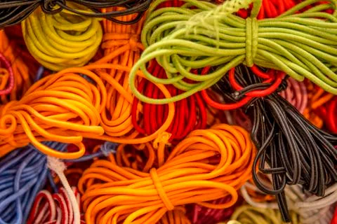 Fluorescent orange and yellow string cords 스톡 사진