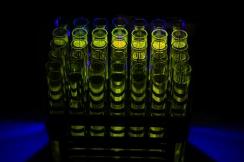 Fluorescent organic compound solution collected from column chromatography in Stock Photos