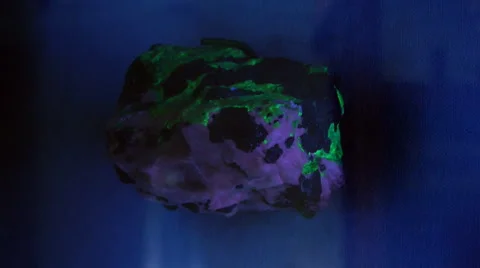 Fluorescent rock under UV and white light Stock Footage 1847845