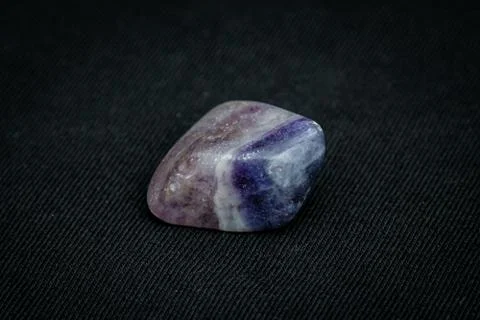 Fluorite precious gemstone with smooth surface in purple and blue tones Stock Photos