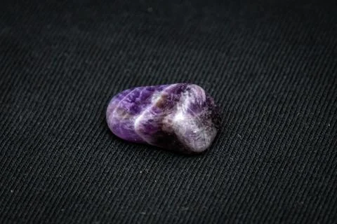 Fluorite precious gemstone with smooth surface in purple and grey tones Stock Photos