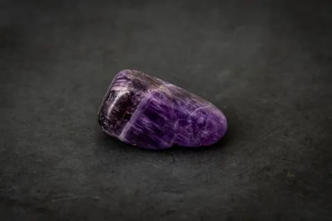 Fluorite precious gemstone with smooth surface purple and grey tones Stock Photos