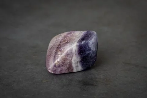 Fluorite precious gemstone with smooth surface purple and grey tones Stock Photos