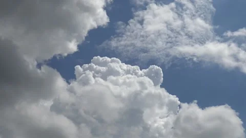 A flurry of cloud activity on blue sky Stock Footage 159075679