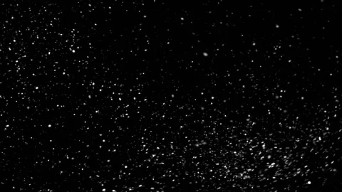 Flurry of snow particles isolated on a black background Stock Footage 125764355