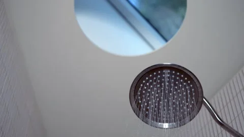 Flush mounted shower head in bathroom with skylight Stock Footage 265097993