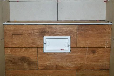 Flush system in a tiled box Stock Photos
