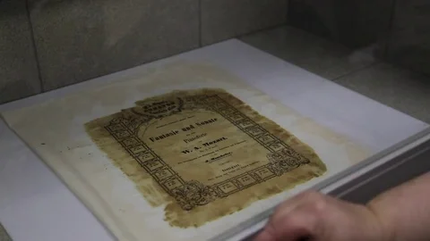 Flushing an old sheet of paper Stock Footage 79678953