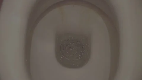 Flushing water in old dirty ceramic toilet bowl, close up view from above Stock Footage 264150259