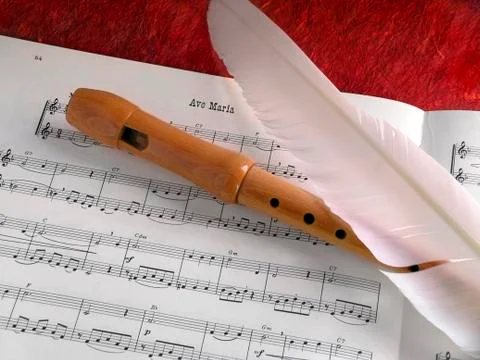 Flute and feather Stock Photos