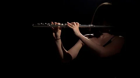 Flute Player in Shadows Stock Footage 111928253