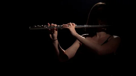 Flute Player in Shadows Video stock 111928506