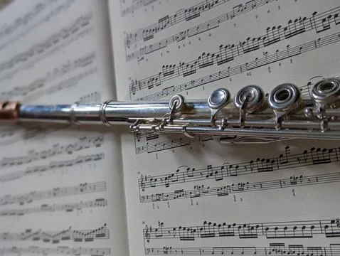 Flute on Sheet Music Stock Photos